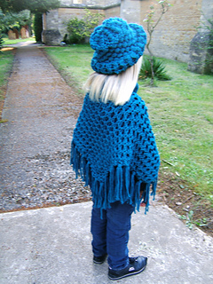 Poncho_and_hat_by_church_path_back_shot_small2