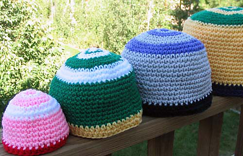 Festive_hats_crochet_on_rail_medium