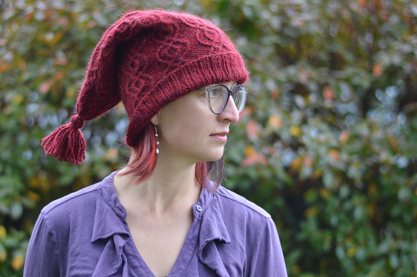 woman in red hat looking right