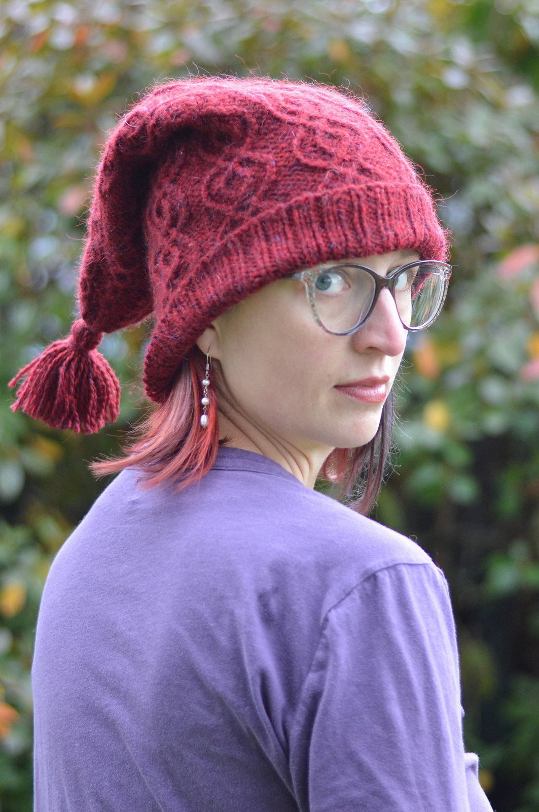 woman in red hat looking over her shoulder